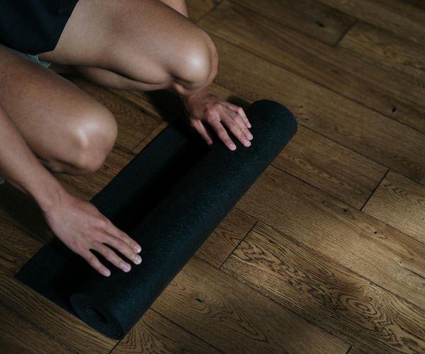 A serene setting with yoga mats, suggesting a peaceful practice environment.