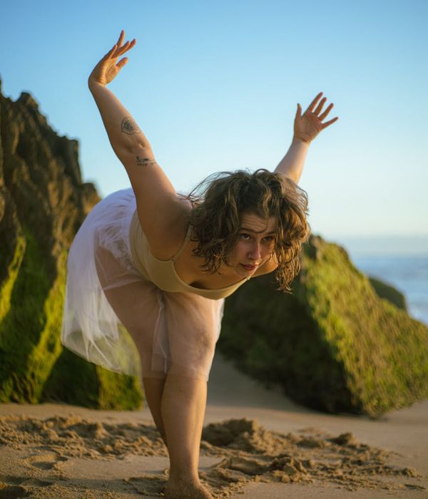 Woman in a calm yoga pose, embodying harmony and balance.